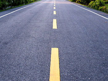 Yellow arrow symbol on road in city