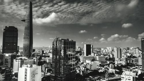 High angle view of city against cloudy sky