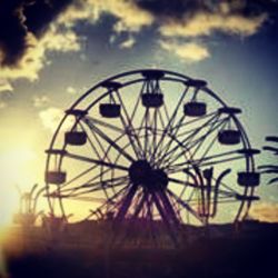 Low angle view of ferris wheel against sky