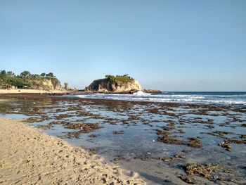 Rocky beach under blue sky