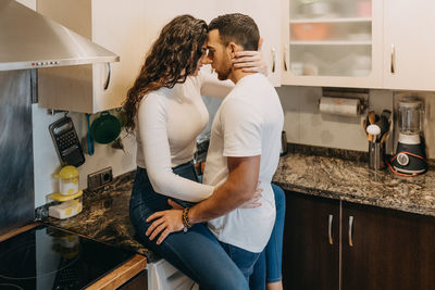 Couple kissing at home