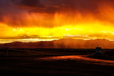 View of cloudy sky over road during sunset