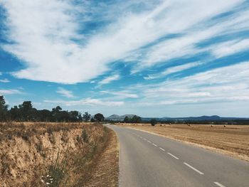 Empty road against sky