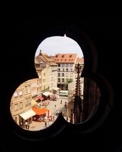 High angle view of buildings seen through window