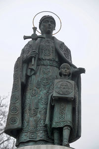 Low angle view of statue against sky