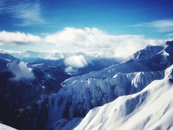 Scenic view of snowcapped mountains against sky
