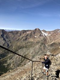 Man on mountain against sky