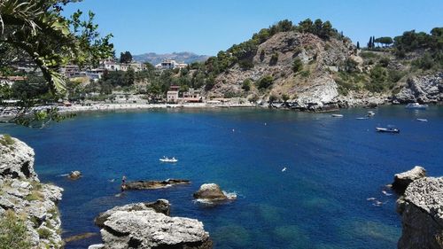 Scenic view of sea and rocks against sky