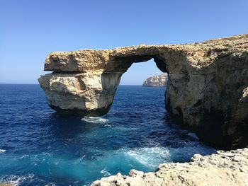 Scenic view of sea against clear blue sky