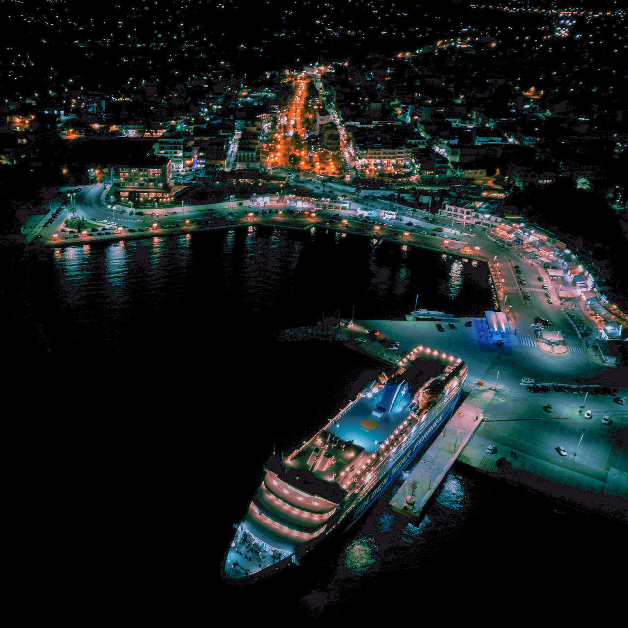 HIGH ANGLE VIEW OF ILLUMINATED CITY