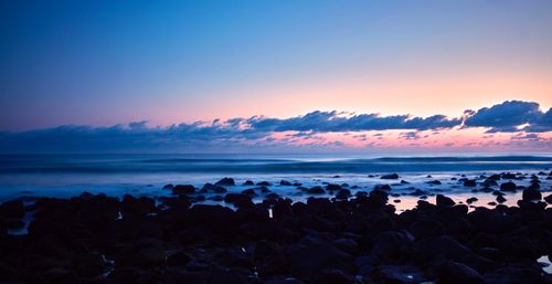 Scenic view of sea against clear sky during sunset