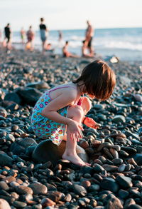 Little girl playing at the beach