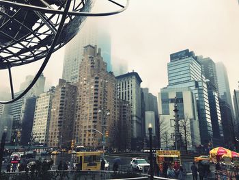 Low angle view of modern buildings in city against sky