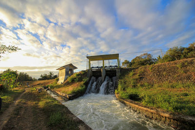 Scenic view of bridge over river against sky