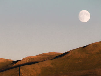 Low angle view of moon against sky at night