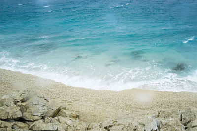 Scenic view of sea against blue sky