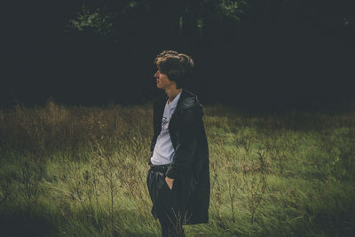 Young man standing on field