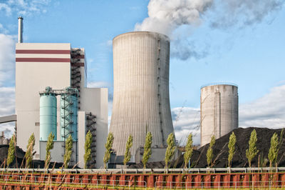 Low angle view of factory against sky