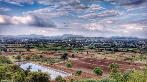 Aerial view of agricultural landscape against sky