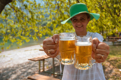 Portrait of smiling man holding beer glass