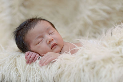 Cute baby sleeping in bed