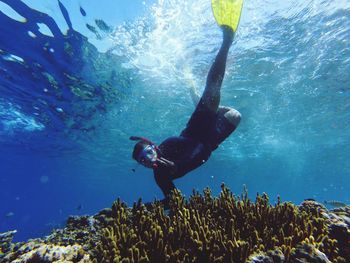 Young man snorkeling in sea