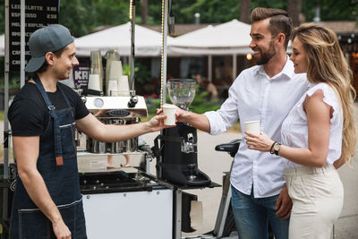 Couple taking coffee at cafe