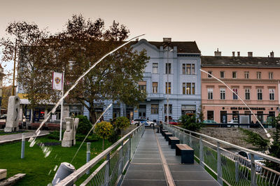 Street amidst buildings against sky