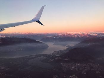 Aerial view of landscape against clear sky during sunset