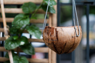 Close-up of heart shape hanging on wood