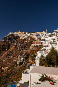 High angle view of townscape against clear blue sky