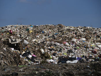 Stack of garbage against blue sky