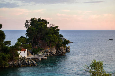 Scenic view of sea and buildings against sky