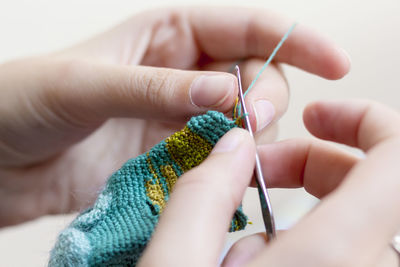 Close-up of cropped hand crocheting