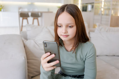 Young woman using mobile phone