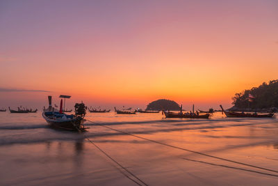 Scenic view of sea against clear sky during sunset