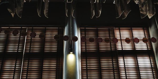 Low angle view of illuminated window in building