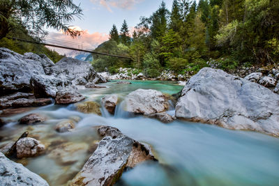 Scenic view of waterfall against sky