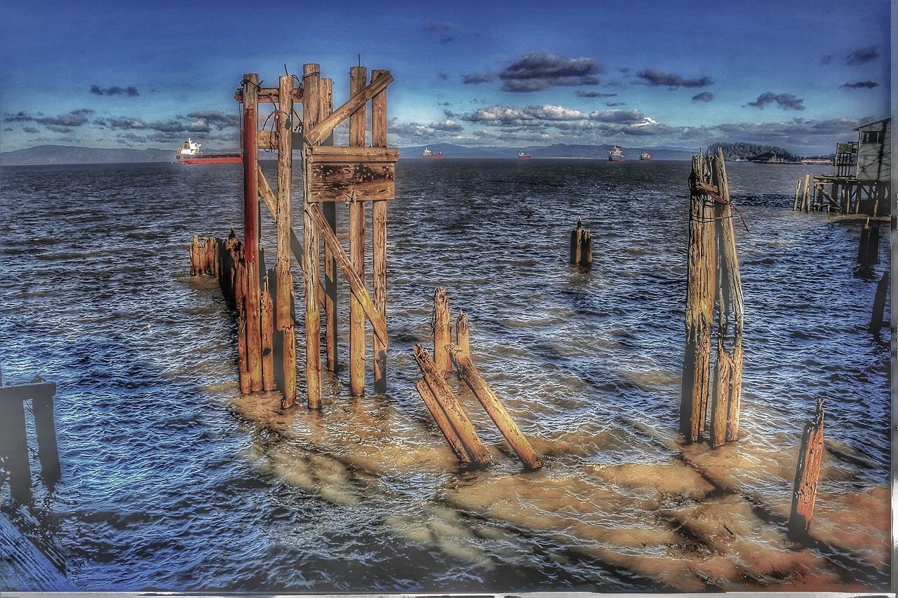 water, sky, sea, cloud - sky, wood - material, nature, horizon, horizon over water, no people, post, tranquility, land, beauty in nature, beach, tranquil scene, wooden post, scenics - nature, motion, built structure, outdoors