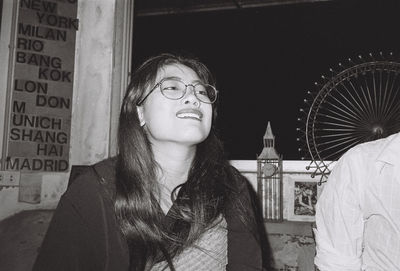 Portrait of young woman looking at camera