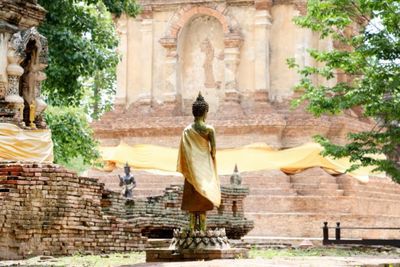 Statue against historic building