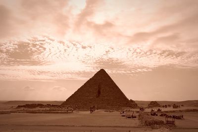 View of a desert against cloudy sky