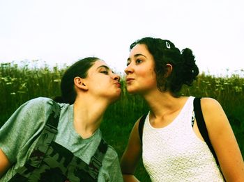 Portrait of young couple against sky