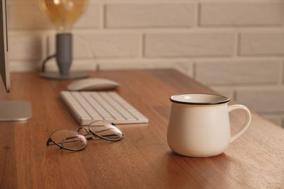 Home office - workplace at a wooden table in a cozy home