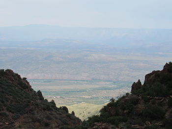 Scenic view of landscape and mountains against sky