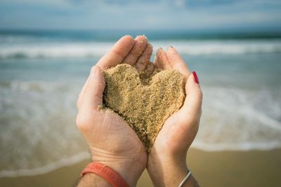 Cropped image of woman on beach