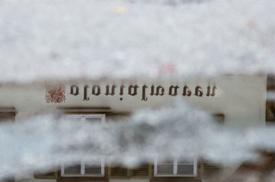 Close-up of text on snow
