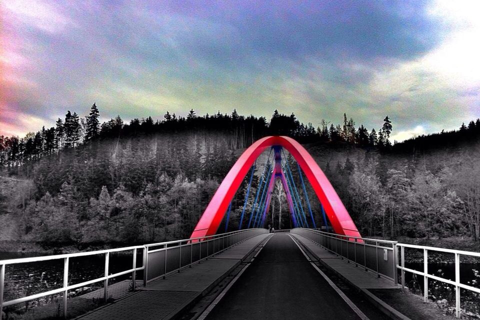 the way forward, sky, cloud - sky, transportation, diminishing perspective, vanishing point, connection, railing, built structure, red, cloudy, architecture, cloud, dusk, landscape, sunset, nature, tranquility, bridge - man made structure, tree