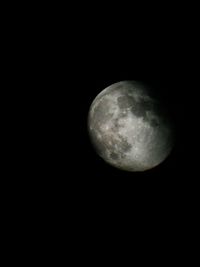 Low angle view of moon against sky at night