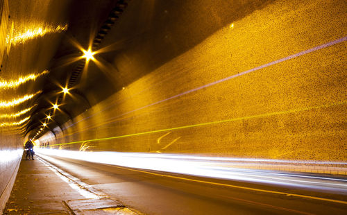 Light trails on road in tunnel